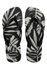 Chancletas Havaianas modelo Aloha en color beige con estampado tropical de hojas en negro y tiras finas texturizadas.