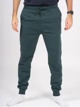 Pantalón de jogging gris melange, corte babucha, con cintura elástica ajustable con cordón y puños en los tobillos. Confeccionado en tejido de punto sin felpa.