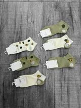 Pack de seis pares de medias cortas con diseños de aguacates y frutillas.