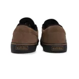 Championes Etnies modelo Barge LS de color negro, con diseño de perfil bajo, suela blanca y detalles en lona y gamuza.