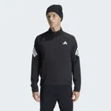 Campera deportiva Adidas de corte clásico, color negro con detalles en blanco. Presenta cierre frontal, cuello alto, bolsillos con cremallera y las icónicas tres bandas de la marca en las mangas. Incluye inserciones de malla para mayor ventilación y dobladillo con cordón elástico ajustable.