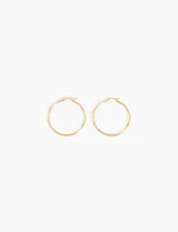 Par de aros tipo argolla de acero quirúrgico hipoalergénico, color dorado, de 4 cm de diámetro.