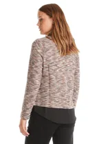 Buzo de tejido fino con efecto melange en tonos tierra, que incorpora cuello y ruedo inferior en tela tipo gasa negra, simulando una camisa debajo. Posee mangas largas y un diseño de corte recto.