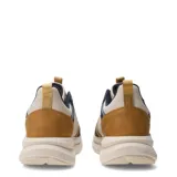 Championes urbanos Umbro modelo Fade, con diseño de paneles en tonos beige, azul marino y detalles en mostaza. Presenta suela de plataforma con relieve y logo de la marca en el lateral.
