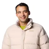 Campera reversible Columbia modelo Wallowa, color beige, con diseño acolchado, cuello alto, cierre frontal con solapa, bolsillos frontales con solapa y puños elásticos.