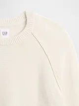 Buzo de punto de algodón con cuello redondo, mangas tipo raglán y puños y ruedo acanalados.