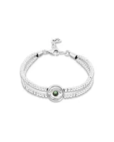 Pulsera doble de aleación de metales bañada en plata, con cuentas de bolas y detalle de ojo con cristal verde.