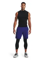 Calza de compresión deportiva Under Armour modelo HeatGear, de largo 3/4, color negro. Presenta cintura elástica ancha con logo de la marca y bolsillo lateral Strength Pocket.