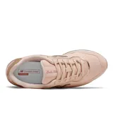 Championes New Balance modelo WLSLAKC1, color rosa pálido con detalles metálicos en tono oro rosado. Presentan el logo 'N' lateral y un diseño de running clásico.