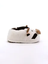 Pantuflas de peluche con diseño de vaca, en colores blanco, negro y marrón.