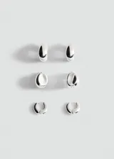Set de tres pares de aros plateados de diseño abombado y minimalista, con acabado brillante.