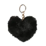Llavero con dije en forma de corazón de peluche sintético negro, con argolla y gancho metálico en tono dorado.