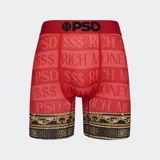 Calzoncillos tipo bóxer de color rojo con estampado de texto "PSD $$$ RICH MONEY" y banda elástica roja con logo PSD en negro. Diseño con ribete inferior con motivos barrocos en dorado y negro.
