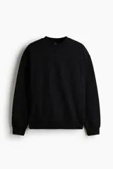 Buzo de mezcla de algodón en color negro, con cuello redondo, hombros caídos y puños y bajo acanalados.