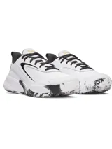 Championes deportivos Under Armour Lockdown 8, de color blanco con detalles en negro y dorado. Cuenta con parte superior de malla transpirable, superposiciones de cuero, entresuela de EVA y suela de caucho con patrón de tracción.