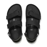 Sandalia Birkenstock modelo Tatacoa de diseño ergonómico, color negro, con tiras de ajuste de velcro y correa de talón. Presenta suela de goma con relieve y plantilla anatómica.