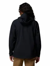 Campera cortaviento impermeable y transpirable Columbia Trailborne 2.5L de color negro, con capucha integrada, cierre frontal bidireccional y bolsillos con cierre.