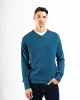 Buzo tejido de punto con cuello en V, de calce regular y mangas largas con puños acanalados.