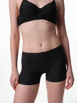 Culotte de microfibra color beige, de tiro medio y diseño sin costuras laterales, con refuerzo de algodón en el fundillo.