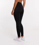 Pantalón legging deportivo de tiro alto, confeccionado en poliamida y elastano, con diseño ajustado y costuras reforzadas.