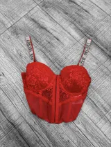 Top corset con copas preformadas y encaje, con cierre frontal y tiras con strass con la inscripción "LOVE SECRET".