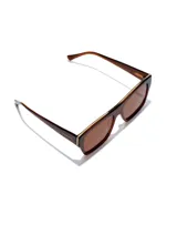 Lentes de sol unisex marca Hawkers, modelo Paula x Hawkers - Doumu Brown. Montura rectangular color marrón con detalles dorados y lentes marrones.