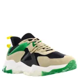 Championes urbanos de diseño robusto con paneles combinados en gamuza beige, malla negra y detalles en verde vibrante. Presenta suela gruesa blanca con secciones en verde translúcido y cierre mediante cordones.
