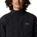 Campera técnica de plumón Mountain Hardwear modelo Stretchdown, color negro, con diseño de celdas tejidas sin costuras para mayor elasticidad. Cuenta con cierre frontal de dos vías, bolsillos laterales con cierre, bolsillo en el pecho y puños elásticos.