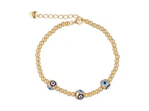 Pulsera de plata 925 con baño de oro y dijes de ojitos de la suerte.