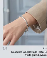 Esclava rígida de plata 925 con diseño minimalista y cadena de seguridad fina.