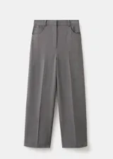 Pantalon de sastreria gris con patron de cuadros muy finos, de corte recto y holgado, tiro medio y bolsillos delanteros diagonales.
