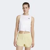 Musculosa deportiva Adidas Essentials Boxy de color blanco, sin mangas, con cuello redondo y corte holgado. Incorpora tecnología Climacool para la absorción del sudor y cuenta con el logo de la marca estampado en negro en el pecho.