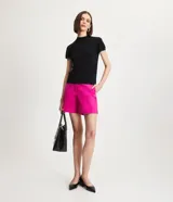 Blusa de punto color celeste, con cuello alto, manga corta y malla texturizada.