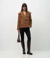 Pantalón skinny de mujer con pliegues delanteros y cintura estructurada, confeccionado en una mezcla de viscosa, poliamida y elastano.