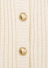 Chaqueta de punto de diseño recto y cuello redondo, con cierre frontal de botones dorados efecto joya y manga larga.