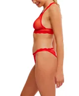 Bombacha tipo colaless de malla celeste con lunares y bordes de encaje ondulado.