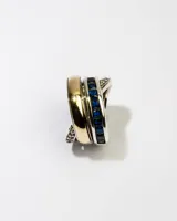 Anillo de plata 925 con dublé de oro y circonias azules y blancas.