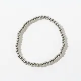 Pulsera elástica de acero con cuentas redondas plateadas.