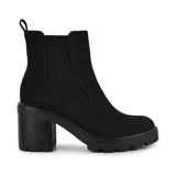 Botas Chelsea de cuero sintético negro, con elástico lateral, caña baja, suela track y taco bloque.