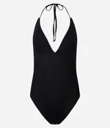 Body negro de tul con diseño halter y escote en V fruncido. Cuenta con tirantes finos que se atan al cuello y un calce ajustado.