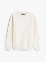 Buzo color crema de Tommy Hilfiger, de corte clásico y cuello redondo. Tiene el logo de la marca bordado en el pecho.