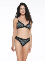 Vedetina con estampado de hojas en tonos verde y negro, con terminaciones en encaje negro.