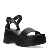 Sandalias de plataforma alta con pulsera al tobillo Miss Carol Krova, color negro, con tira frontal ancha y hebilla metálica plateada.