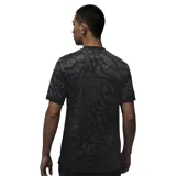 Camiseta de fútbol Nike del Paris Saint-Germain, modelo Alternativa Stadium temporada 2023/24. Diseño negro con estampado tipo piel de elefante en gris y detalles en negro en cuello y mangas. Incluye logo de Nike, escudo del club y sponsor Qatar Airways en el frente.