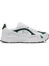 Championes Under Armour Tech Runner, con diseño deportivo de perfil bajo. Presentan una parte superior de malla blanca transpirable con superposiciones de cuero y gamuza en color verde oscuro. Incluyen entresuela de EVA para amortiguación y suela de goma para mayor tracción.