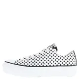Championes Converse Chuck Taylor All Star Lift de plataforma, con diseño de lunares negros sobre fondo blanco. Presenta cordones blancos, puntera de goma y suela de plataforma elevada.