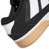 Championes urbanos Adidas Break Start 2000, de diseño robusto en color negro con las icónicas tres tiras laterales en blanco. Presenta una suela de goma color caramelo y una entresuela blanca, con el logo de la marca en la lengüeta.