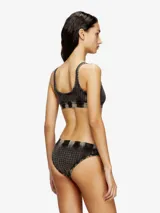Bralette deportivo de suave algodón elástico con escote redondo, banda elástica inferior y estampado de pata de gallo con efecto desgastado tipo denim.