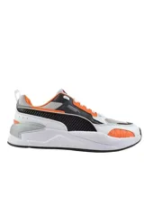 Championes deportivos Puma X-Ray en combinación de azul, gris y negro, con detalles en amarillo flúor y suela blanca y azul.