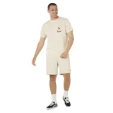 Remera de manga corta color beige, con cuello redondo y pequeño estampado frontal con palmeras y logo de la marca Rip Curl.